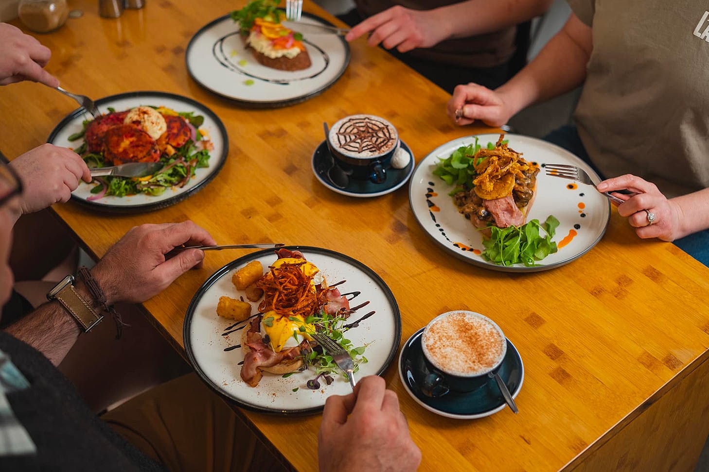 People sit down for a delicious feed at Little Rogue Eatery, one of the best cafes in New Plymouth.